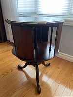 Full view showing table structure, open storage sections, pedestal and legs