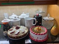 Full group of ceramic and glass kitchenware on countertop