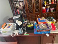 Front view showing shredder, desk lamp, organizer, software boxes and stationery