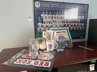 Overall lot with framed team photo and assorted memorabilia on tabletop