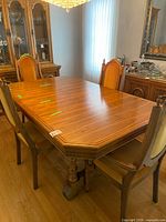 Full view of oak dining table with six chairs