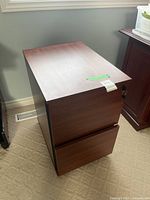 Front and top view of two-drawer wood grain mobile file cabinet
