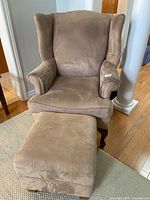 Full view of armchair and ottoman together