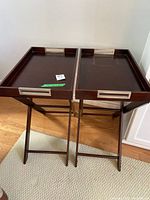 Both butler tray tables on stands