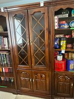 Full front view of cabinet showing glass doors and lower doors