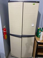 Closed front view of beige Workforce plastic cabinet