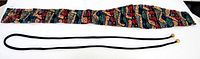 Both belts laid flat: patterned fabric belt and black cord belt