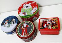 Top view of four Christmas cookie tins