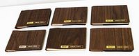 Front view of six brown Black's photo albums