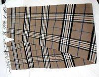 Full view of tan plaid Cashmink scarf with fringe