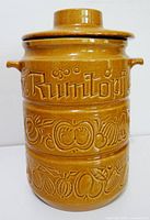 Front view showing Rumtopf text and fruit relief
