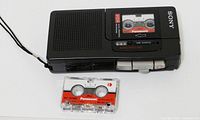Front view of Sony recorder with Panasonic cassette beside it
