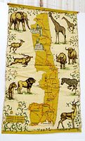 Full view of tea towel with map, animals, dowel and cord