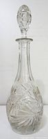 Full view of crystal decanter with stopper
