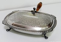 Top view showing etched lid, wood handle and feet