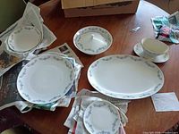 Assorted Bavarian china pieces on table: platter, plates, covered bowl, gravy boat