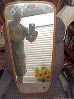 Front view of teak framed mirror