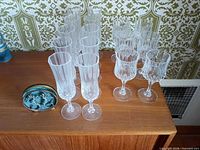 Group view of 10 flutes, 6 wine glasses, 5 coasters