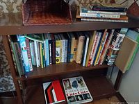 Overall view of two shelves showing quantity and variety of books