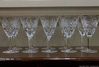 Group view of all ten cut crystal wine glasses