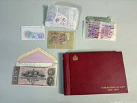 Overall lot showing album, Confederate note, envelopes and stamp packets