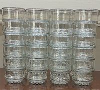 Front view of four stacks of Libbey Nob Hill rocks glasses