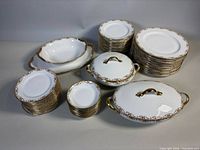 Full lot showing platter, covered bowls, stacks of plates and fruit cups