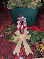 Overall lot showing tote, swags, bow, picks and ornaments