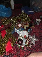 mixed craft and decor items spread on floor