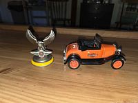 Model A coin bank and eagle ornament side by side