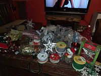Overview of assorted Christmas craft supplies and decorations on table