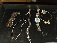 Entire lot displaying watch, bracelets, earrings, ring