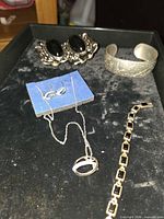 Overview of all six jewelry pieces on tray