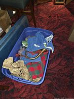 Overview of tote showing horn, plaid fabric, towels