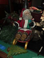 Overall view showing animated Santa in sleigh, metal tree and garland