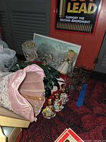 Overview showing angel tree topper, Arby's glasses, ceramic angels, string lights