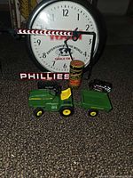 Group shot showing tractor, trailer, clock, barrier arm, Phillies lettering, tin and one Matchbox car
