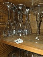 Group of tulip glasses on shelf