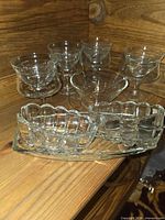 Set showing cocktail dishes, liners, relish dish, condiment bowl