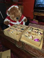 Lot overview showing bear and two trays of ornaments