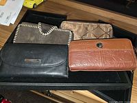 Front view of all four wallets