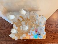 Top view showing arrangement of glass candle holders and cloches
