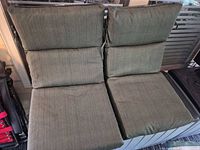 Two olive green cushions side by side showing seat and back sections