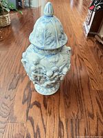 Full view of blue and white ceramic vase with lid
