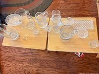 Overhead view of all glass pieces on two tables showing quantity and variety