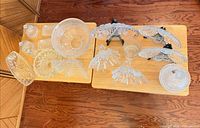 Overview of all pressed and frosted glass items on two tables