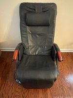 Front view of HoMedics DeStress Ultra massage recliner showing upholstery, armrests and overall condition