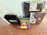 Group shot showing all five packaged items leaning against wall