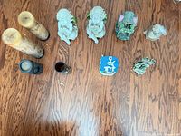 Full layout of cherub figurines, fairy house, candles, vase and additional resin ornaments