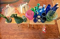 overview of assorted blown glass pieces on tables
